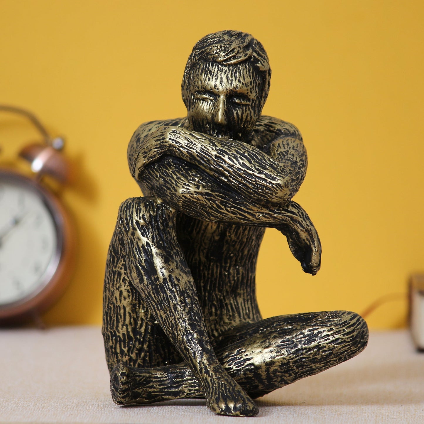 Golden and Black Polyresin Man Figurine Sitting in Thinking Position